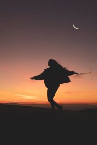 silhouette of woman running during golden hour